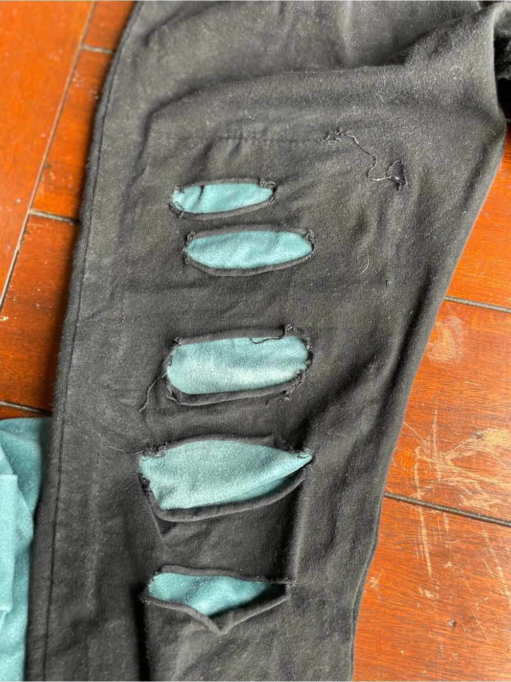 Kids Black Leggings & Top with Teal Peekaboo Detail -